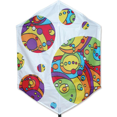 56 in. Rokkaku Kite - Rainbow Orbit in flight, showcasing its colorful rainbow design against a blue sky with clouds.