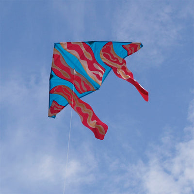 Vibrant 56-inch Delta kite with a bacon design flying in the sky against a clear blue backdrop, showcasing its playful aesthetic.