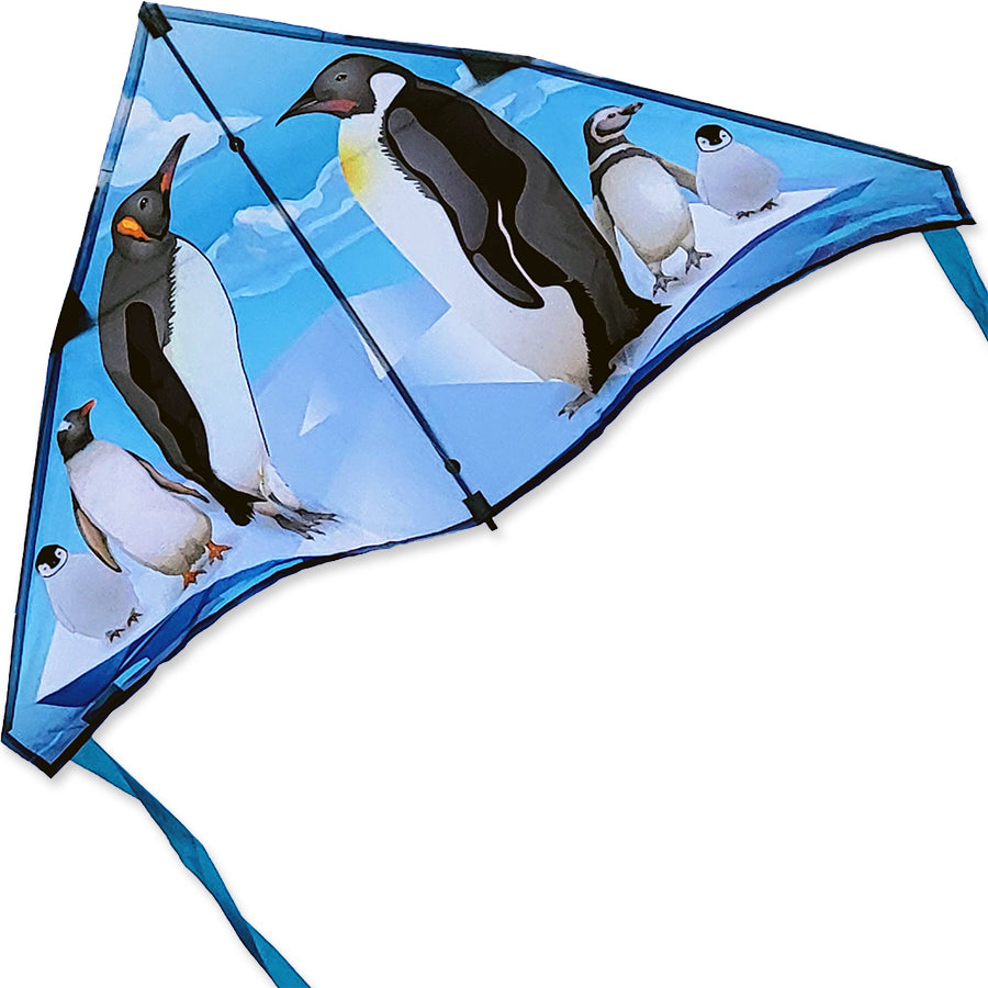 56 in. Delta Kite featuring penguin graphics flying in a bright blue sky, showcasing stability and playful design for outdoor fun.