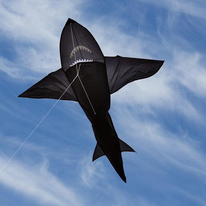 6' 3D Shark Kite with realistic design soaring across a blue sky, featuring tooth-lined jaws and a whipping tail for added excitement.
