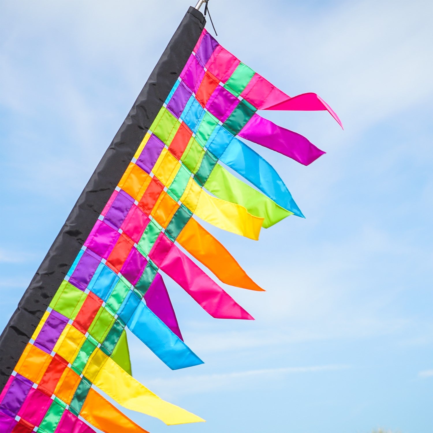 6-foot fiesta weave banner featuring interwoven strips of vibrant colors, draping elegantly with tails that sway in the wind, enhancing any event or store.