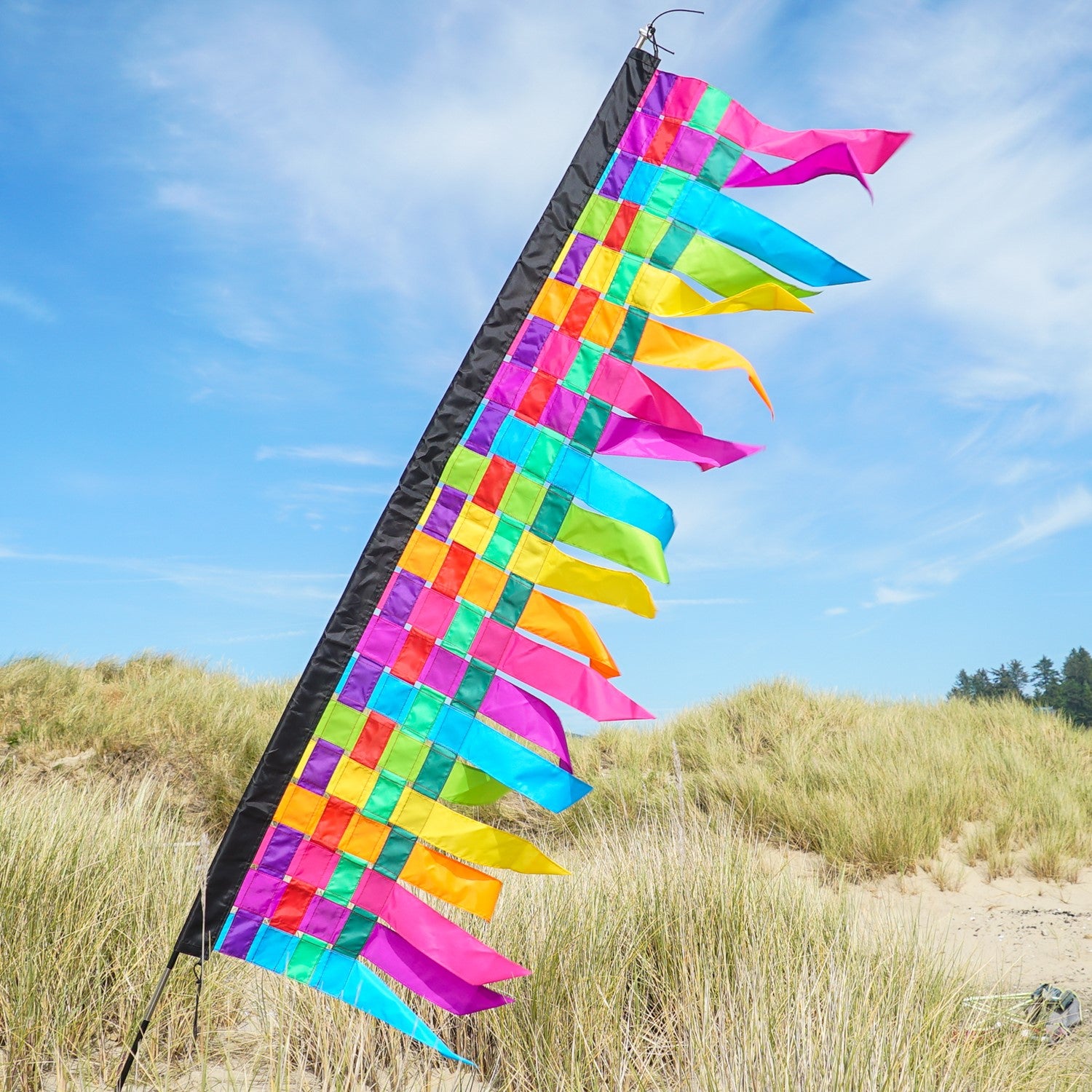 6-foot fiesta weave banner featuring interwoven strips of vibrant colors, draping elegantly with tails that sway in the wind, enhancing any event or store.