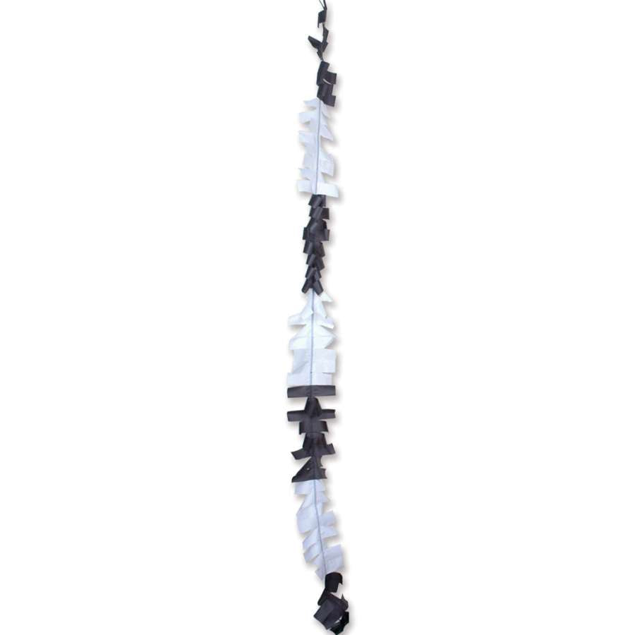6 in. x 24 ft. Fuzzi Tail in Black/White attached to a colorful kite soaring against a clear blue sky.