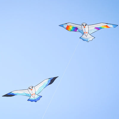 70-inch Blue Seabird Kite featuring a vibrant design and felt details soaring against a clear sky, ideal for outdoor flying adventures.
