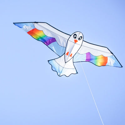 70-Inch Peace Seabird Kite soaring in the sky with a colorful design, showcasing a whimsical seabird and felt details.