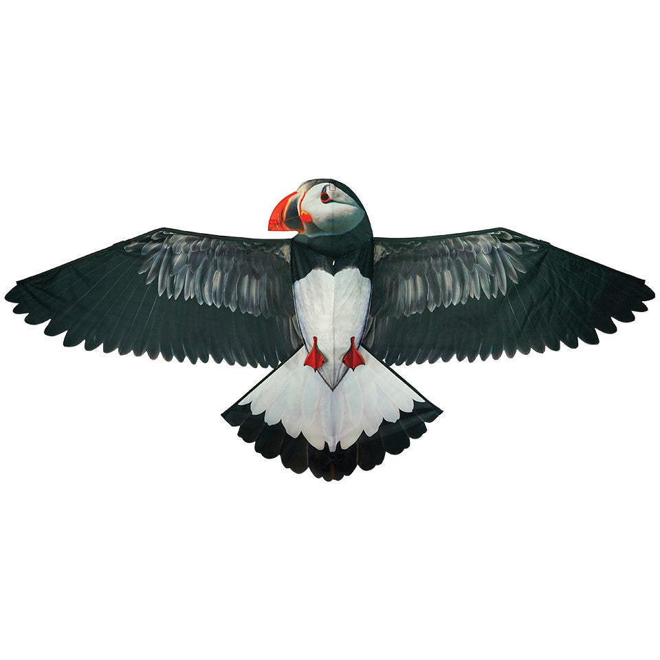 70-inch Puffin Kite soaring in a blue sky, showcasing a realistic puffin design with applique feet, perfect for beach and outdoor activities.