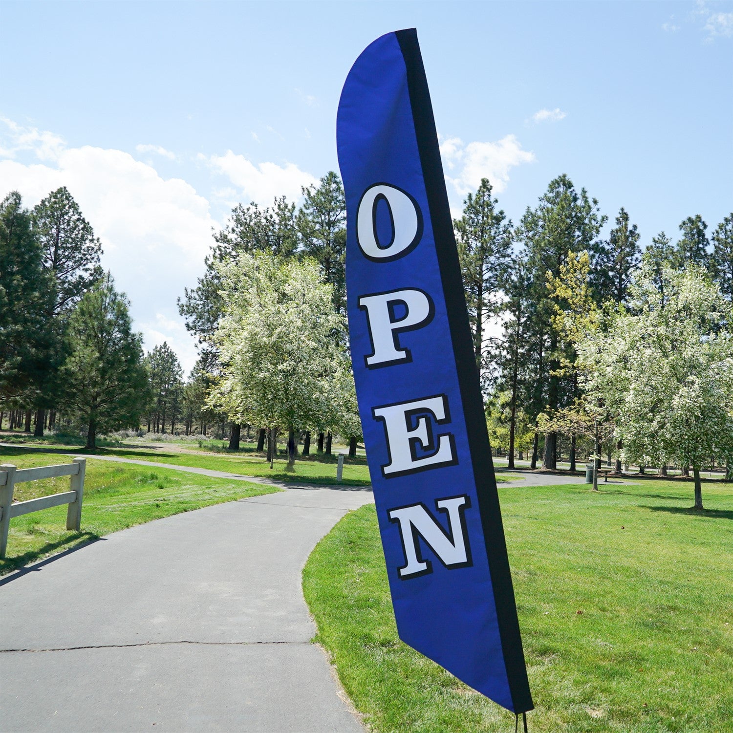 8' Heavy Duty Open Navy Double Sided Feather Banner displayed outdoors, showcasing bold 'OPEN' text designed for visibility and durability.