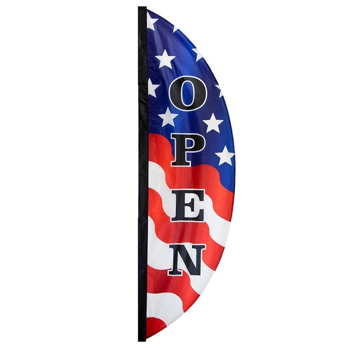 8' Patriotic Open Feather Banner with stars and stripes design gently fluttering in the breeze, displayed outside a storefront.