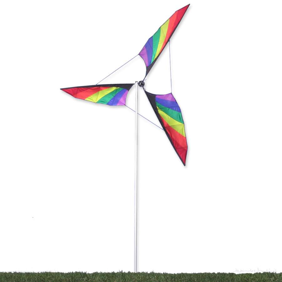 9.5 ft. Wind Generator - Rainbow showcasing colorful rotating blades spinning gracefully atop an aluminum mast in a garden setting.