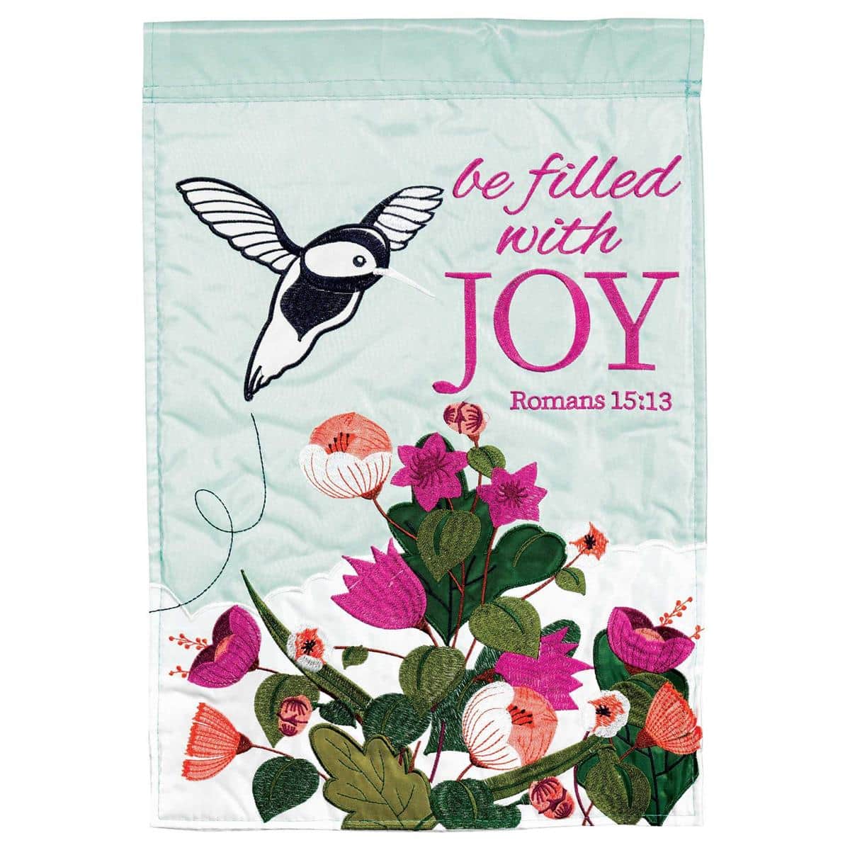 Be Filled With Joy Rom. 15:13 double applique garden flag on a small black metal garden stand, 13x18 flag with layered fabric appliques showing scripture text and decorative borders against a landscaped background.