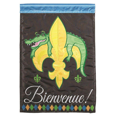 29x42 Bienvenue alligator banner flag double applique showing green alligator with stylized features and French 'Bienvenue' script on a neutral background, hanging on a porch pole.