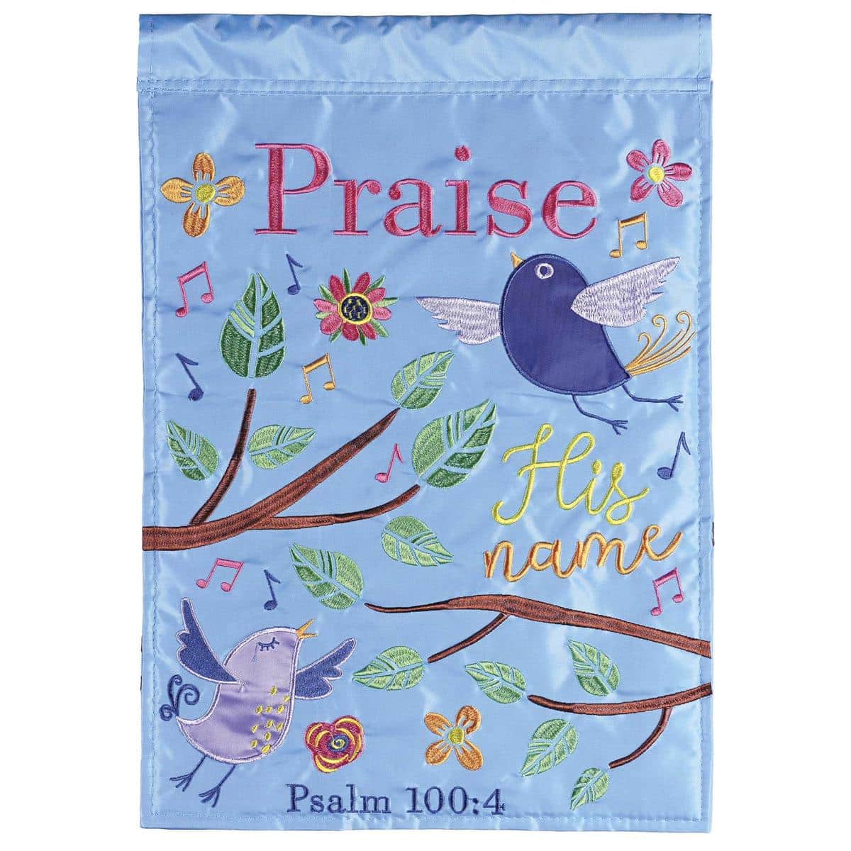 13x18 Birds Praise His Name double applique garden flag showing birds and scripture text hung on a metal garden flag stand in a front yard setting, decorative outdoor faith flag.