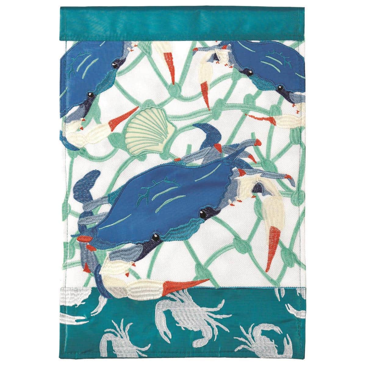 13x18 Blue Crab garden flag with layered double applique crab in coastal blues and sand tones, shown on a low metal garden stand beside a porch step and potted greenery.