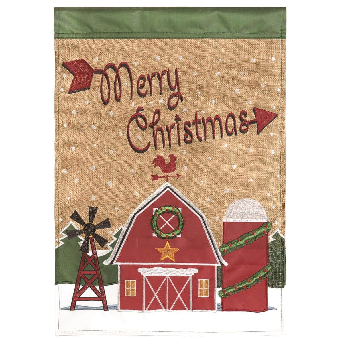 Festive Christmas barn garden flag 13x18 double applique showing a red barn with wreath, snow accents, evergreen sprigs and "Merry Christmas" lettering on a rustic background.