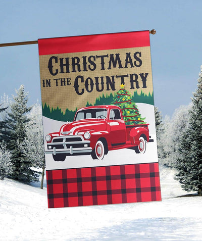 Red vintage country truck Christmas banner flag 29x42 double applique showing a wreath on the truck bed with snowy trees in the background, festive porch decor.