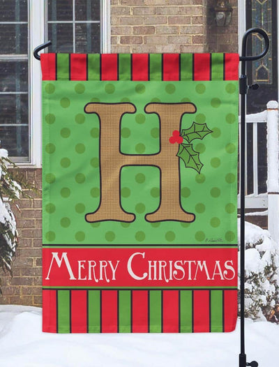 13x18 burlap garden flag featuring a Christmas monogram H with double applique holly, plaid accents, and reinforced sleeve for porch or yard display.