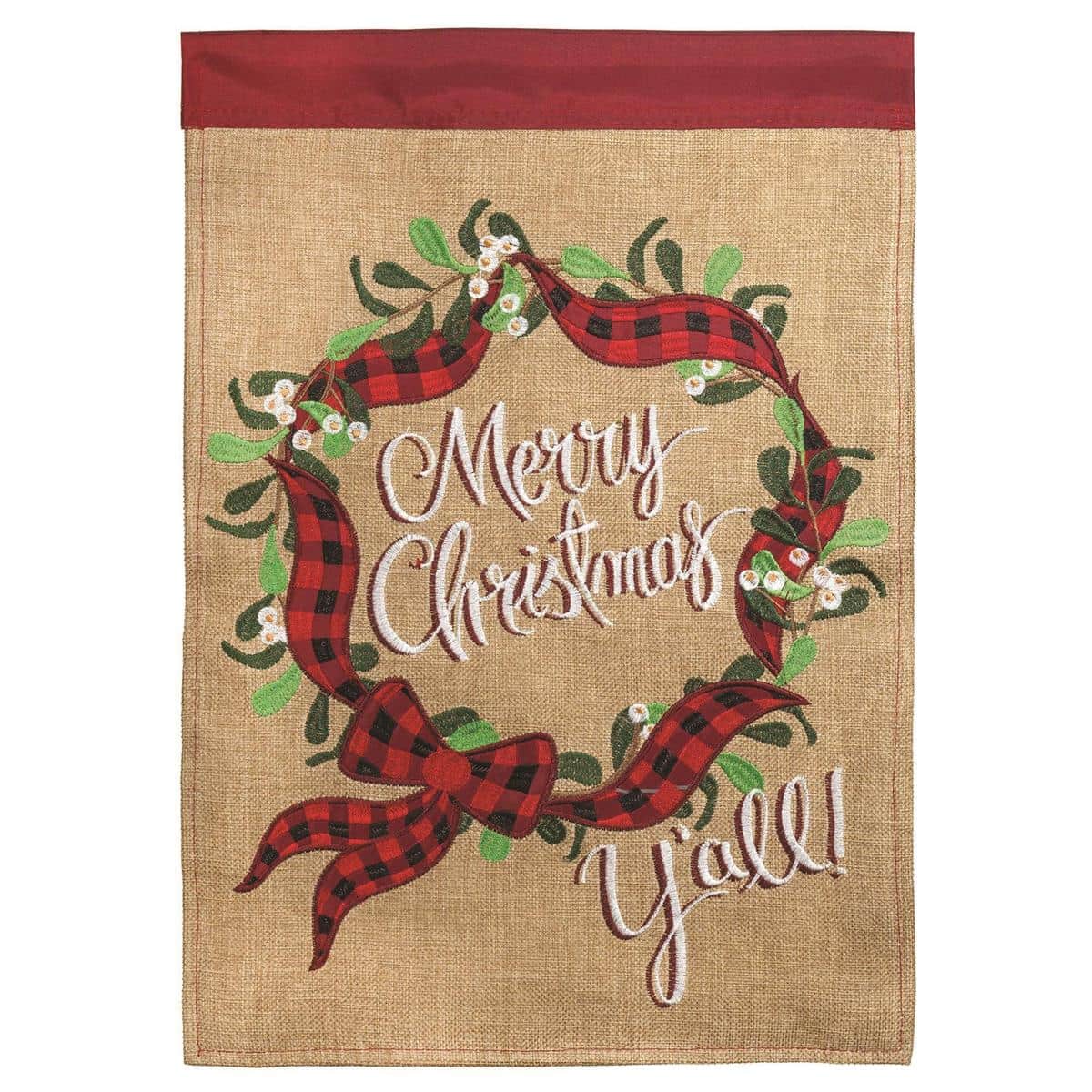 Festive 29x42 Christmas wreath banner flag with double applique, green pine wreath and red bow on a light background, durable polyester construction shown on a porch pole for outdoor seasonal display