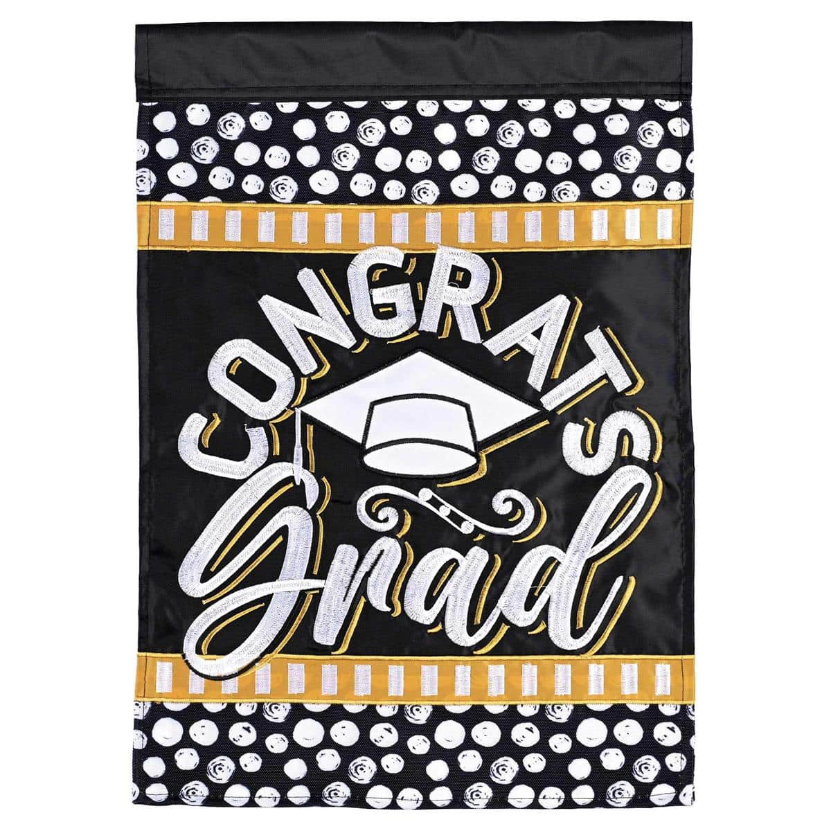 13x18 Congrats Grad garden flag double applique featuring mortarboard caps, diploma and bold "Congrats Grad" lettering hanging from a black metal garden flag stand in a front yard setting.
