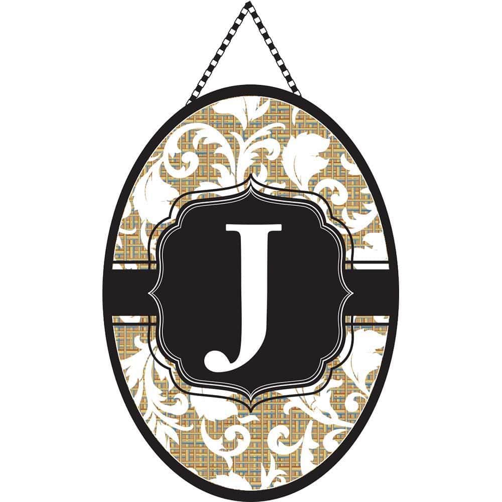 Close-up photo of the Door Banner Monogram-J hanging on a front door, showing a bold decorative letter J centered on a durable everyday style fabric with a reinforced top sleeve for hanging.