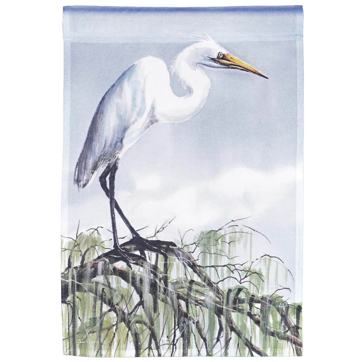 Waterfront garden flag featuring a perched egret above calm reeds, 13x18 inch printed design in coastal blues and soft whites with top sleeve for standard stake