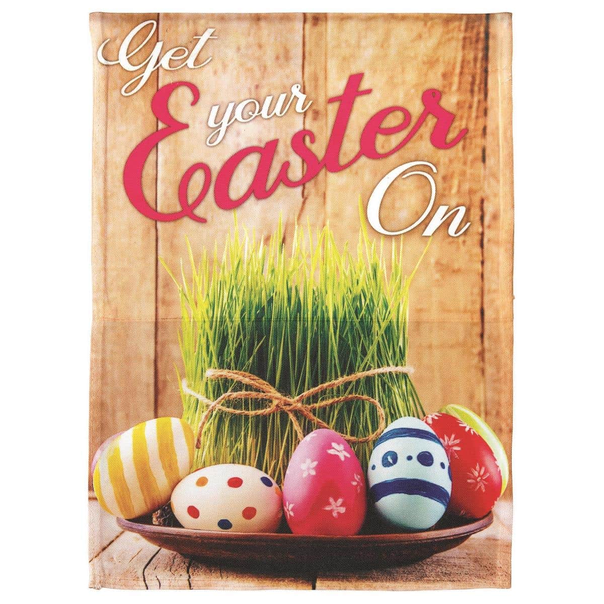 Colorful Get Your Easter On 13x18 garden flag displayed on a standard black metal garden flag pole in a spring porch scene with pastel eggs and floral accents, perfect for seasonal outdoor decor.