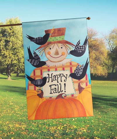 30x44 Happy Fall Scarecrow printed banner flag showing smiling scarecrow, pumpkins, fall leaves, and 'Happy Fall' greeting hanging on a front porch railing for seasonal decor.