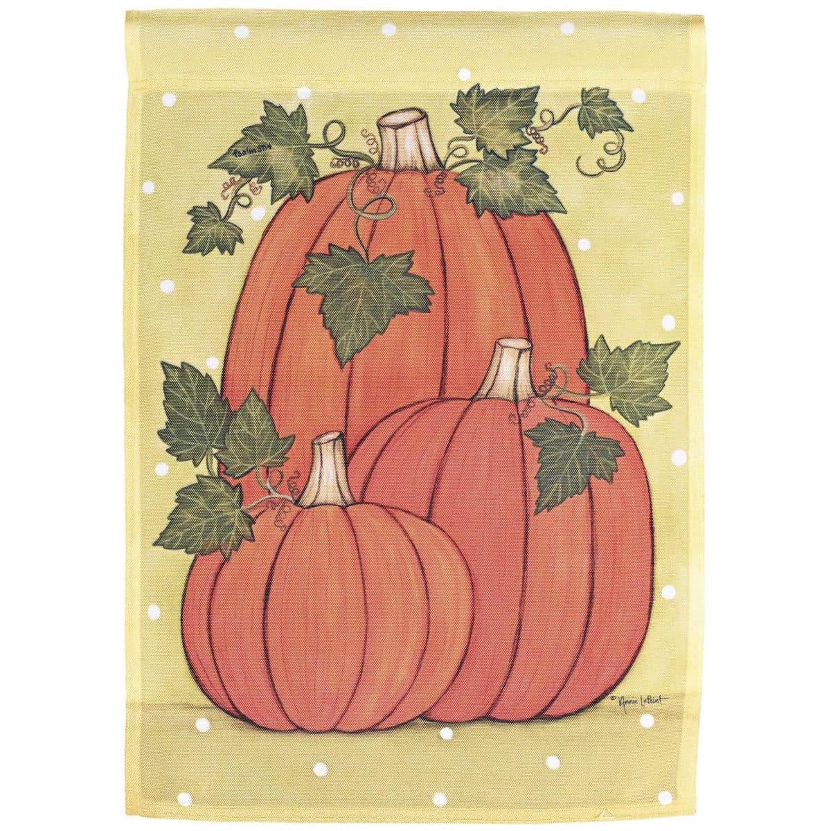 Happy Pumpkins Garden Flag 13x18 printed fall pumpkin design on weather-resistant polyester with top sleeve, displayed on a garden stand near mums and porch decor