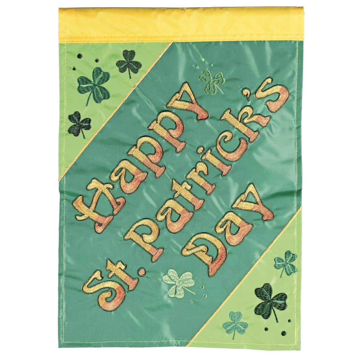 Green shamrocks, gold accents, and Happy St Patricks Day lettering on a 13x18 double applique garden flag shown hanging from a metal garden pole in a spring yard display.