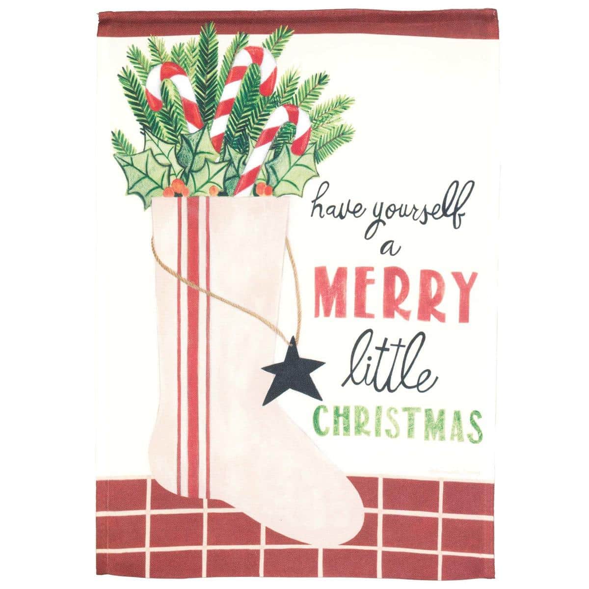 Have Yourself A Merry Little 13x18 printed Christmas garden flag on a decorative stand in a festive front yard with holly and winter greenery.