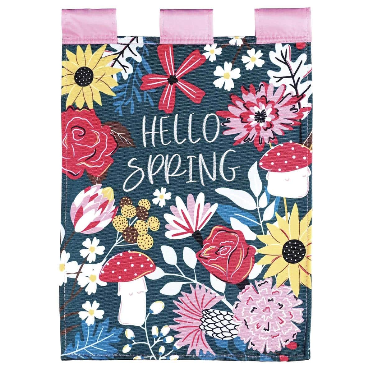 13 x 18 Hello Spring double applique garden flag with flowers and whimsical mushrooms, bright two sided design on a standard garden stand by a walkway.