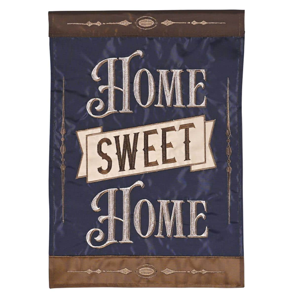 Home Sweet Home 13x18 double applique garden flag on a black metal garden stake surrounded by seasonal flowers, showing layered fabric textures and stitched lettering in close detail.