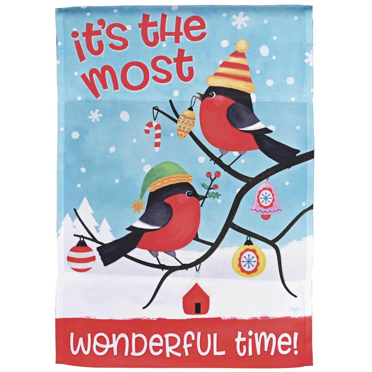 Printed Christmas garden flag showing a cozy house scene with perched birds, greenery, and the phrase "The Most Wonderful Time" in festive type, ideal for porch or lawn display.