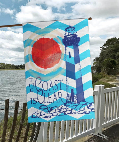 Alt text for main product image: 30x44 printed lighthouse coastal banner flag displayed on a porch pole with waves, cliffs, and lighthouse silhouette in nautical colors.