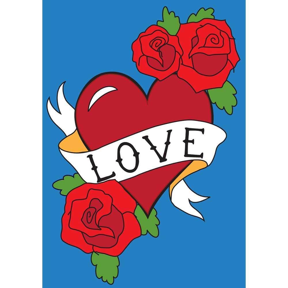 13x18 Love garden flag with double applique heart motif, embroidered accents, and layered fabric textures displayed on a garden flag stand in a sunny yard.