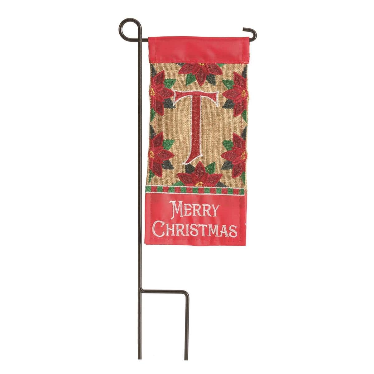 Close-up photo of the Mini Christmas Monogram-T 4x8 mini flag showing a bold letter T monogram in festive colors with seasonal accents, suitable for porch planter or mailbox display.