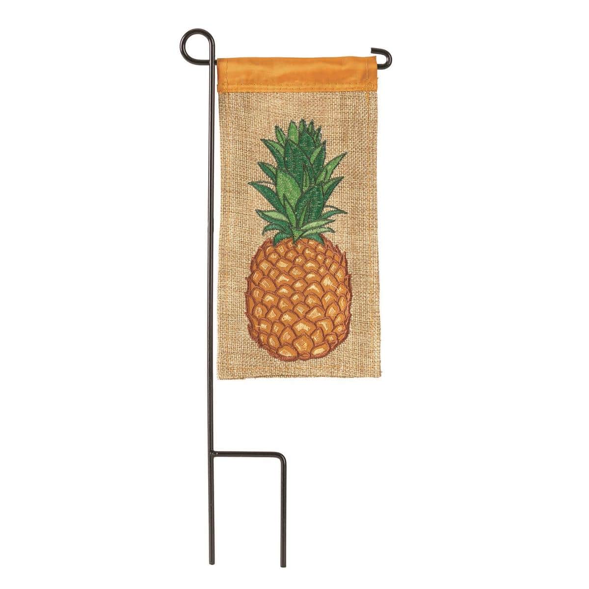 Close up of a 4 x 8 inch mini burlap flag featuring a bright pineapple motif printed on natural burlap with reinforced sleeve for small pole display and textured farmhouse style.