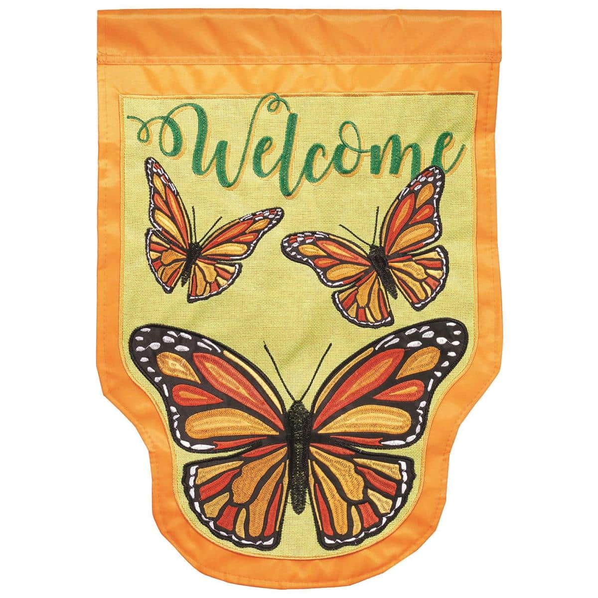 Close-up of a 13x18 Monarch Butterfly shaped garden flag with double applique layers, embroidered floral accents, and bright orange and black wing details displayed on a garden pole.