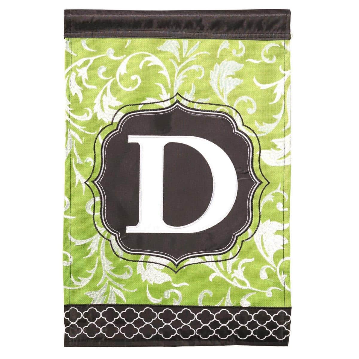 Green and black monogram garden flag featuring a bold letter D in double applique detail on a 13x18 polyester garden flag displayed on a lawn.