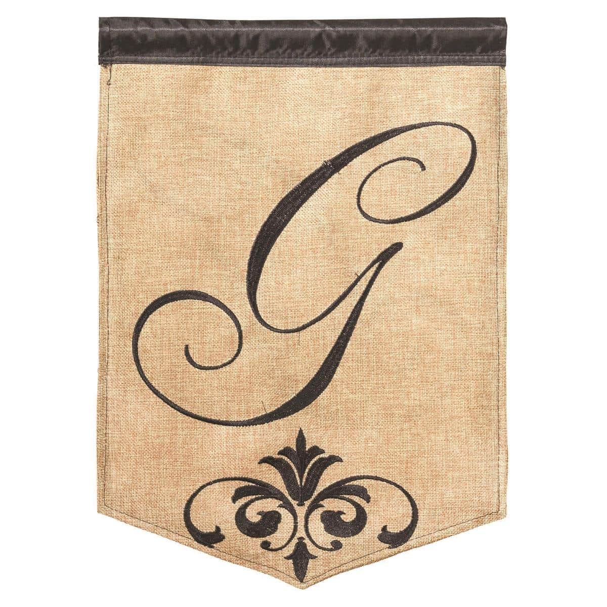 Textured burlap 13x18 garden flag with bold stitched monogram letter G, double applique detail, displayed on a metal stand by a front walkway