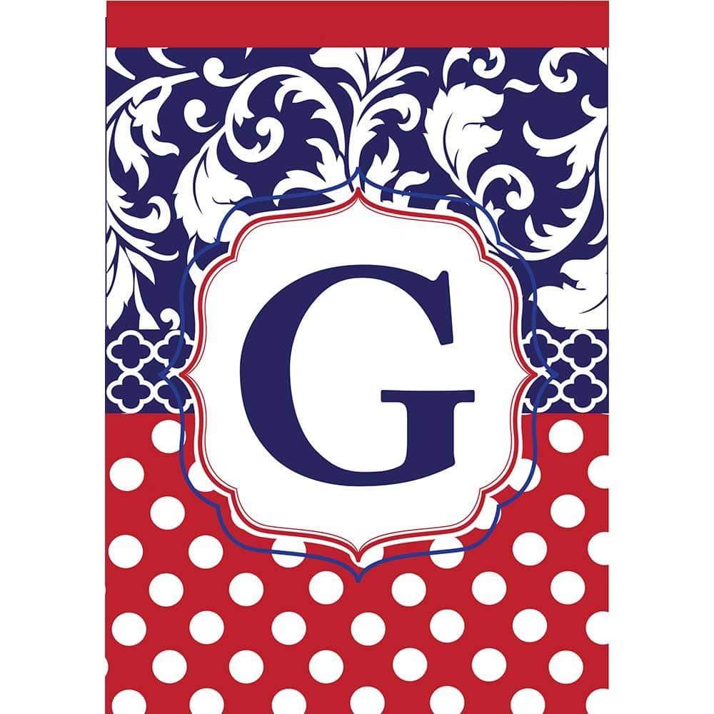 Close-up of 13x18 double applique Monogram-G garden flag in red white and blue displayed on lawn with garden flag pole.