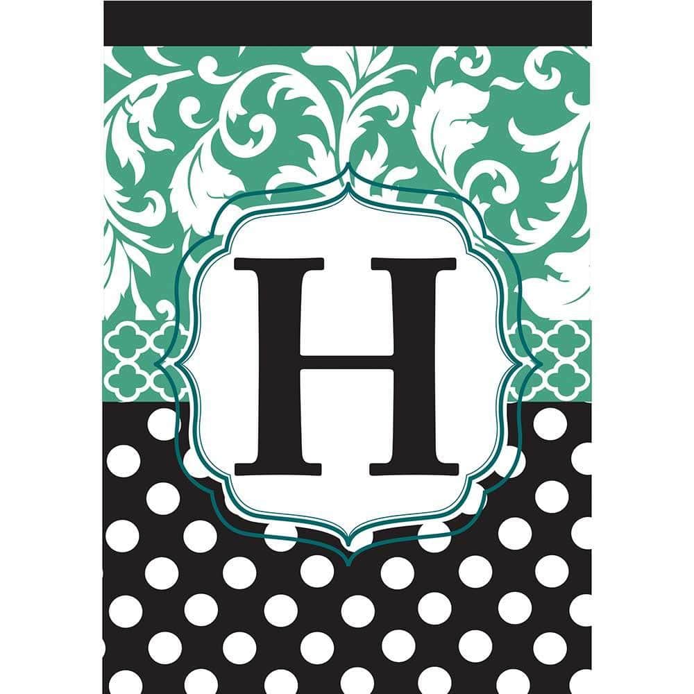 Monogram H black and aqua double applique 13x18 garden flag displayed on a metal stake beside flowers and a front walkway