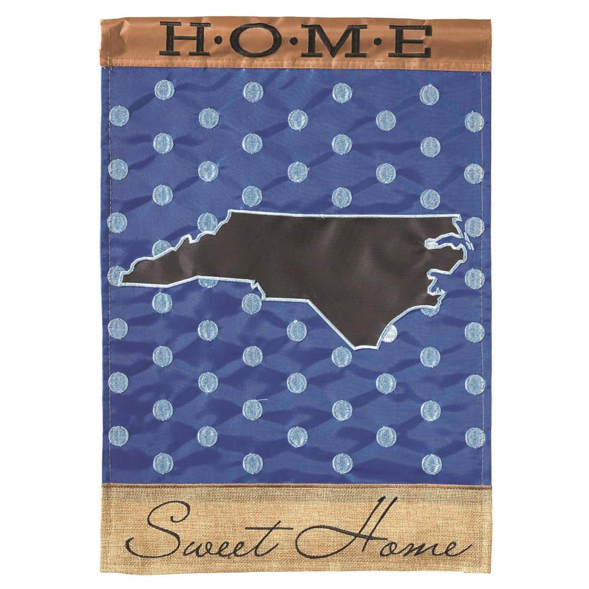 North Carolina Home burlap garden flag 13x18 double applique showing North Carolina silhouette and "Home" lettering on textured burlap background, displayed on a metal garden flag stand in a landscaped front porch setting with potted greenery and wooden steps visible