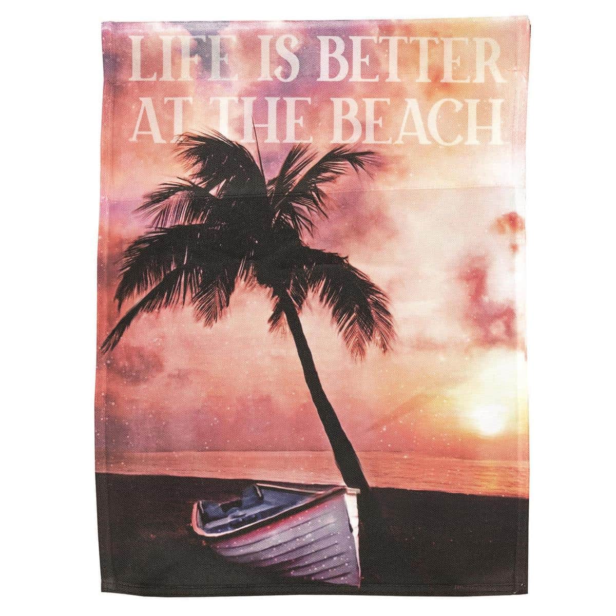 13x18 Palm Tree Sunset garden flag showing silhouetted palm trees against an orange and purple sunset over water, printed waterfront design suitable for coastal and beach decor.