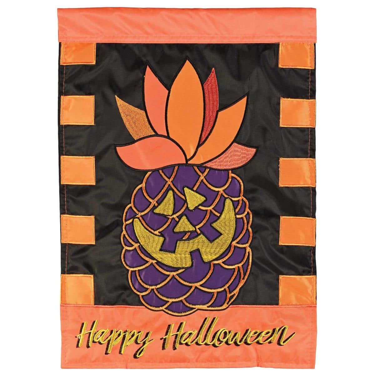 Double applique 13x18 Halloween garden flag featuring a carved pineapple jack o lantern with layered stitching, displayed outdoors on a garden stand near the entry
