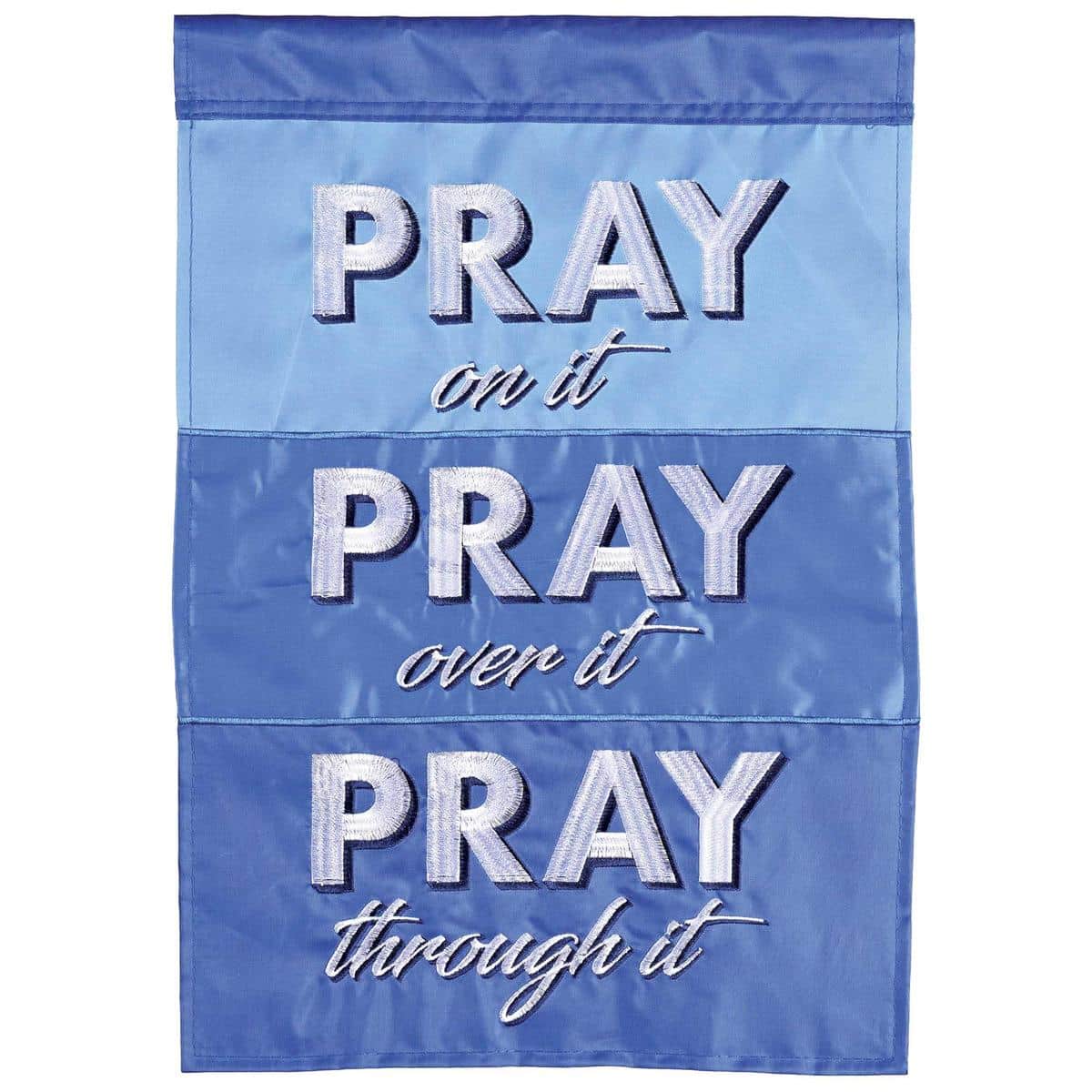 Pray On Over Through It double applique prayer flag with layered lettering, textured background, and reinforced pole sleeve waving on a front porch.