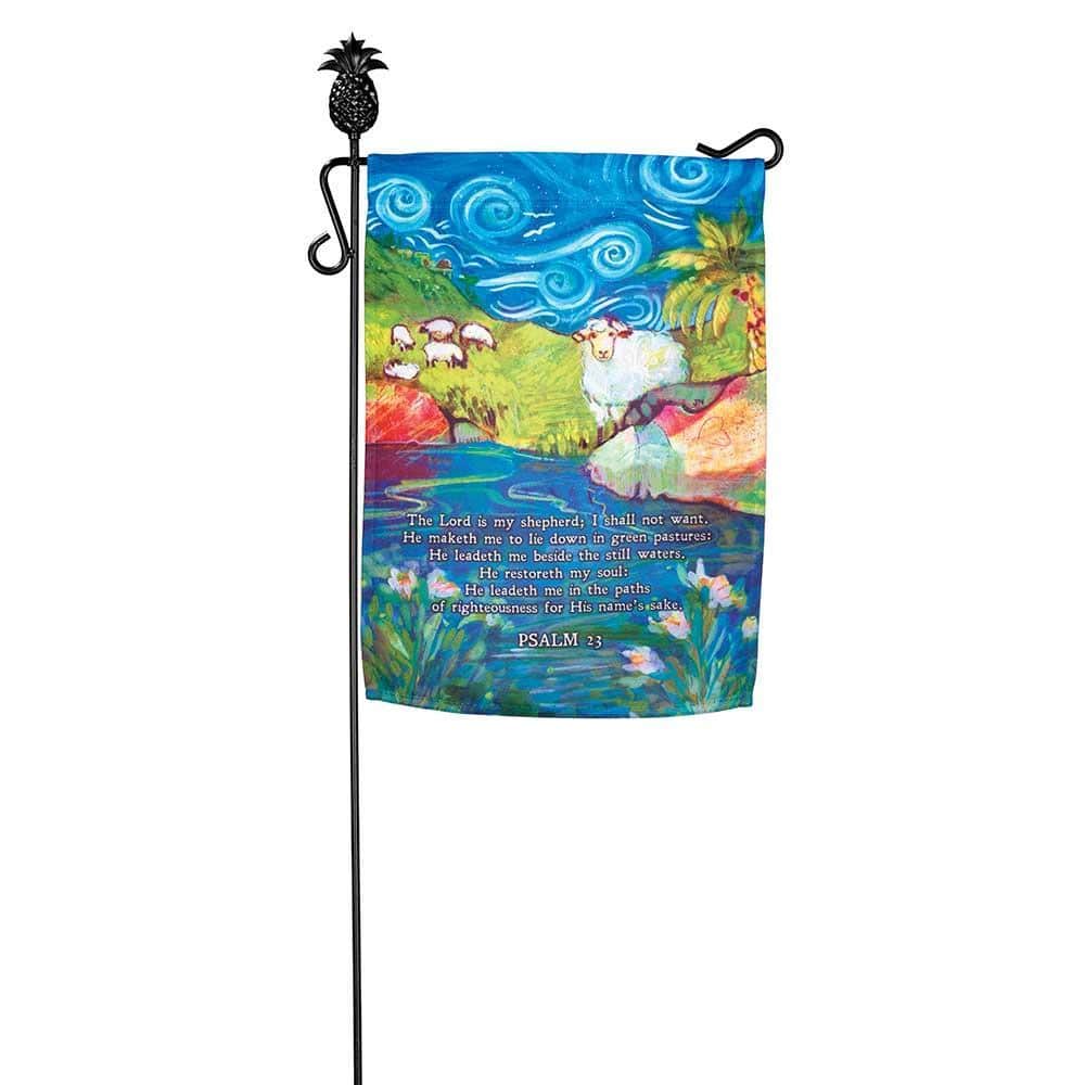 Psalm 23 with sheep printed 13x18 garden flag on stake by flowers, pastoral green hills and scripture typography, faith home outdoor decor