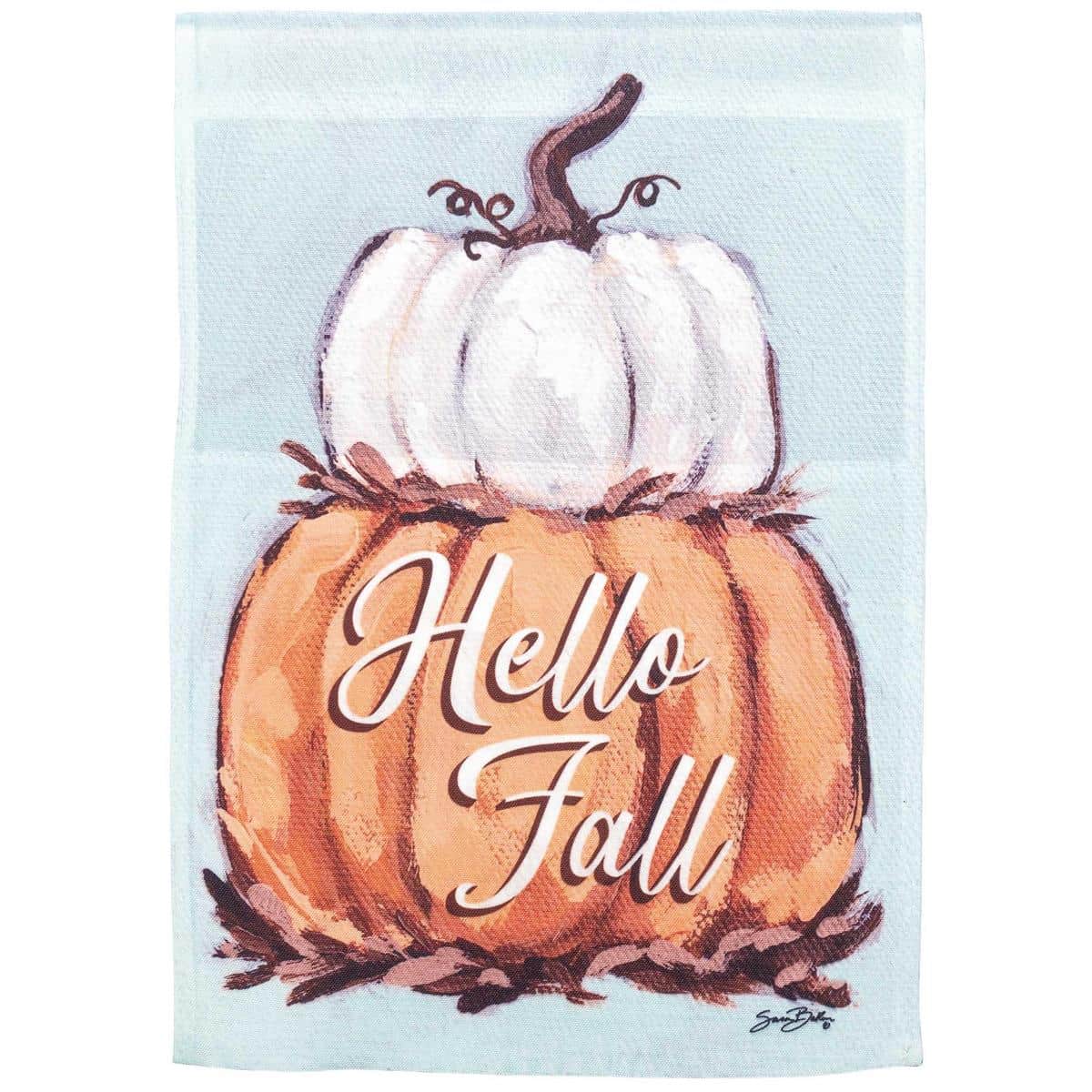 13x18 Pumpkin Stack Garden Flag displayed on a black metal garden pole among fall planters, showing stacked pumpkins, autumn leaves, and warm harvest colors in a close-up view.