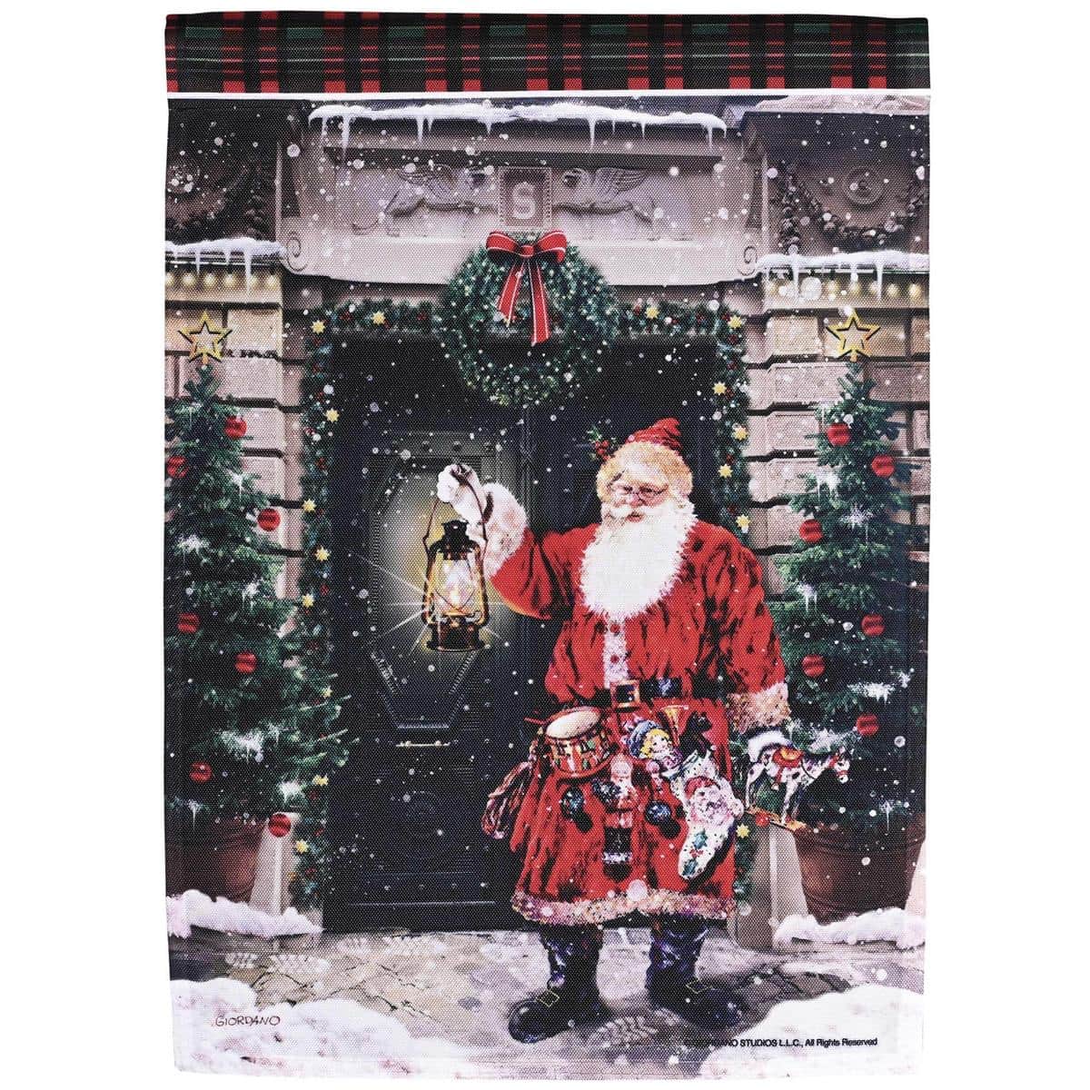 13x18 Santa garden flag with printed Santa face in red suit holding gifts on a snowy holiday background, ready to display on a standard garden flag pole.