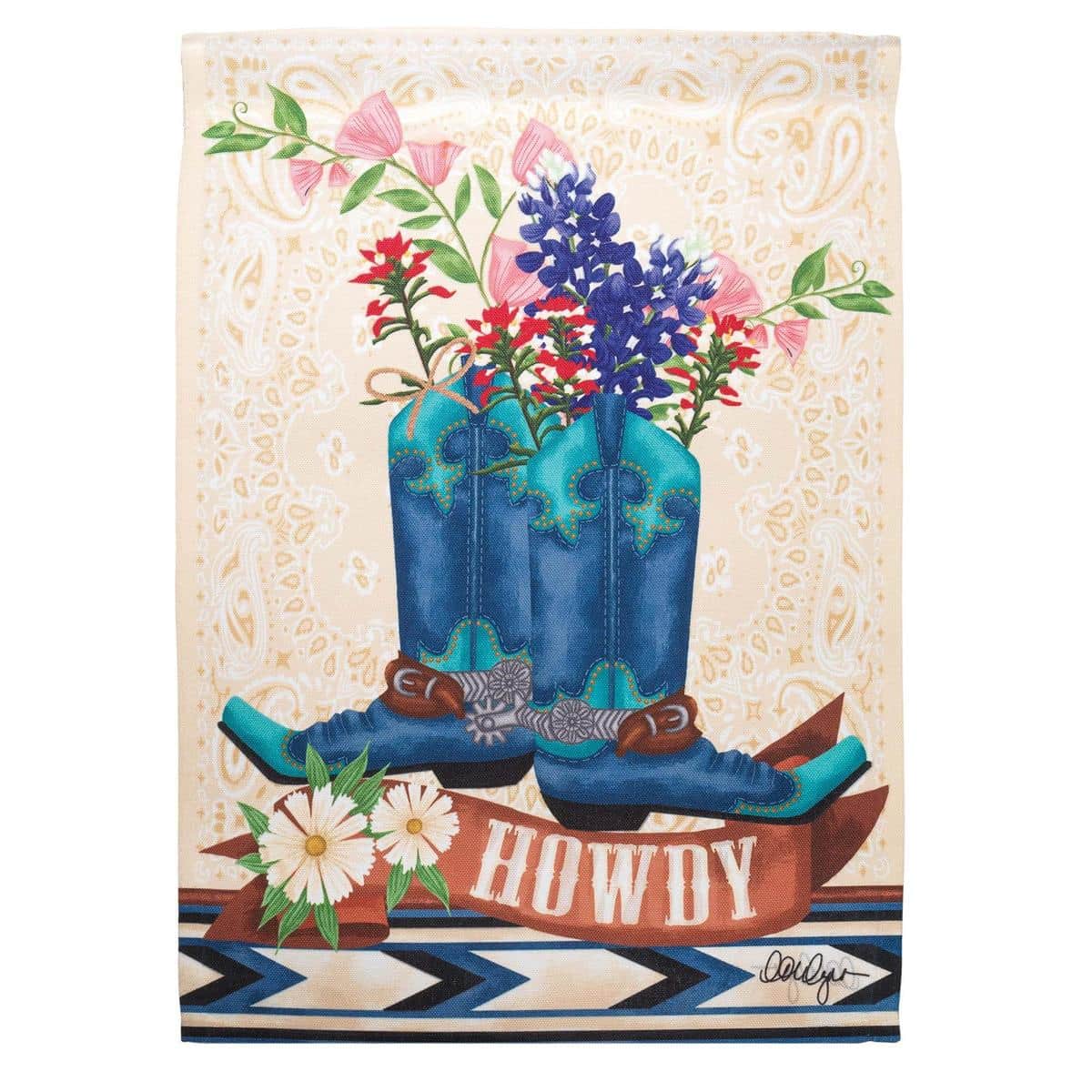 Close-up photo of a 13x18 printed Texas Bluebonnets garden flag showing vivid bluebonnet flowers and green foliage on a bright background, displayed hanging on a standard yard flagpole in a landscaped garden.