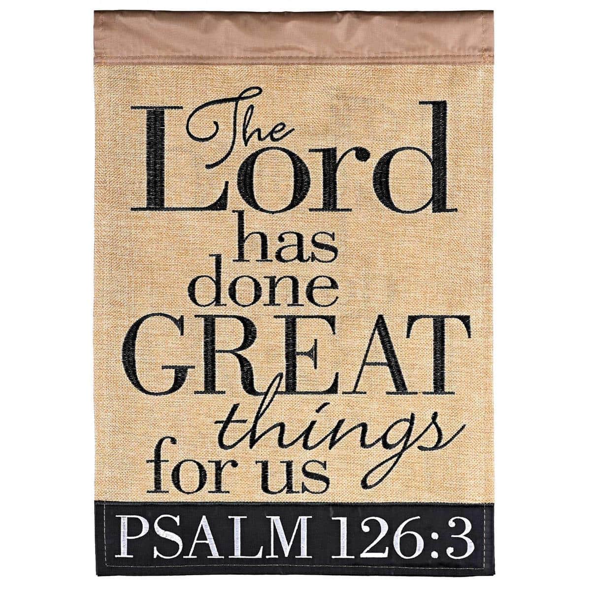 Double applique scripture flag reading The Lord Has Done Great Psalm 126:3 displayed on a porch with layered fabrics, stitched lettering, and a reinforced sleeve for hanging as outdoor devotional decor.